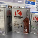 KATMOTO K7 5W-30 and K9 ECO 0W-20 engine oils with CVT fluid in a distributor display